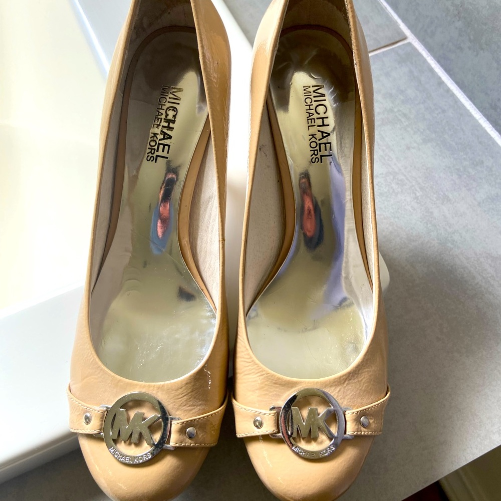 Michael Kors heels. Very little use. Tan color and matches everything.